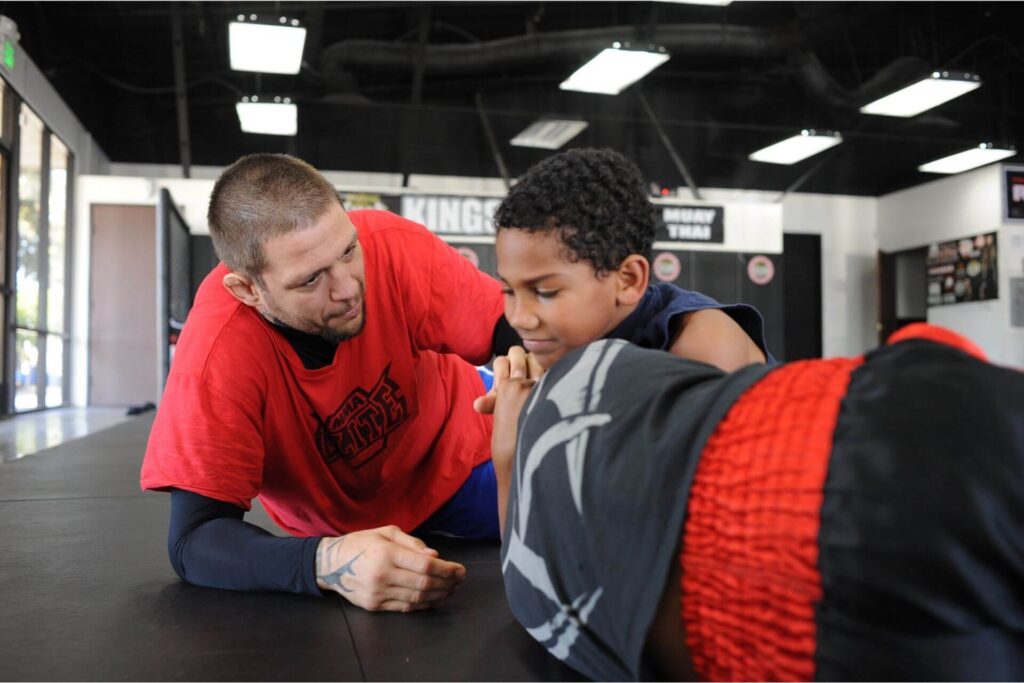 Two kids training in Brazilian Jiu Jitsu with Instructor best martial arts for kids